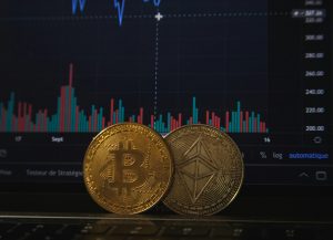 bitcoin cryptocurrency coins in front of market graph