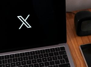 X logo on laptop